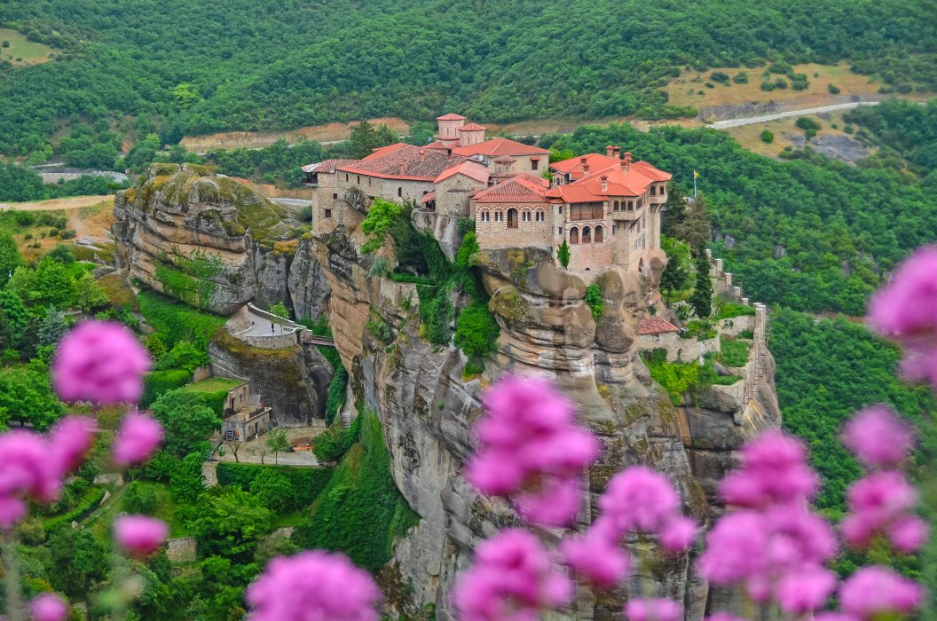 Monastery Meteora Greece. Stunning spring view with pink flowers.